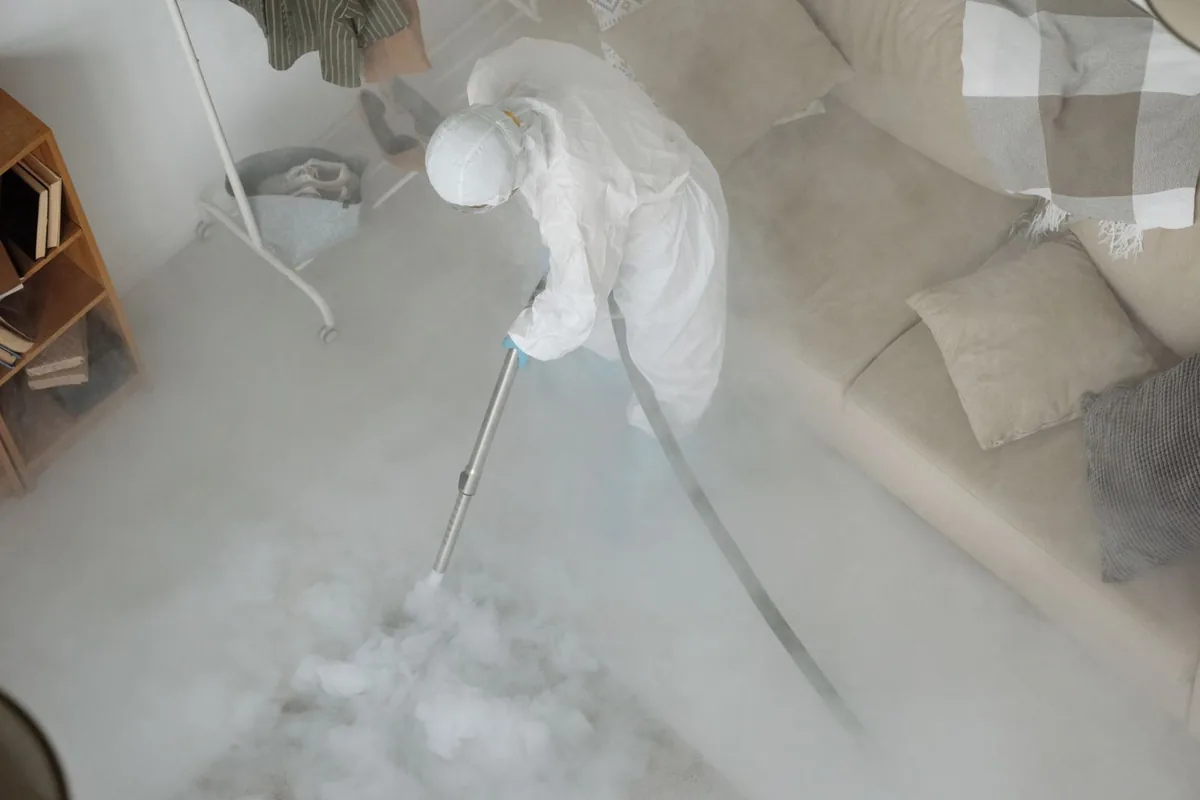 Biohazard cleanup technician in protective equipment, Lipscomb, AL